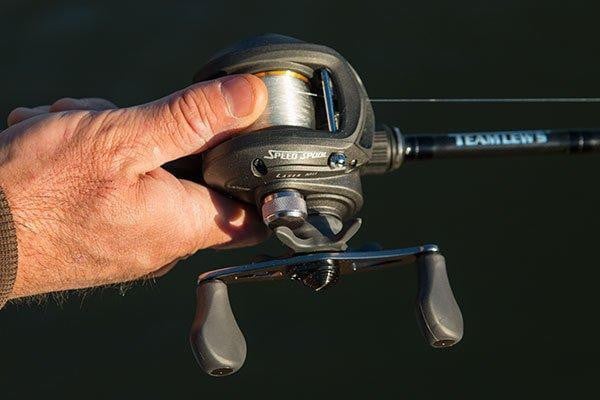 thumbing spool on baitcaster to load rod
