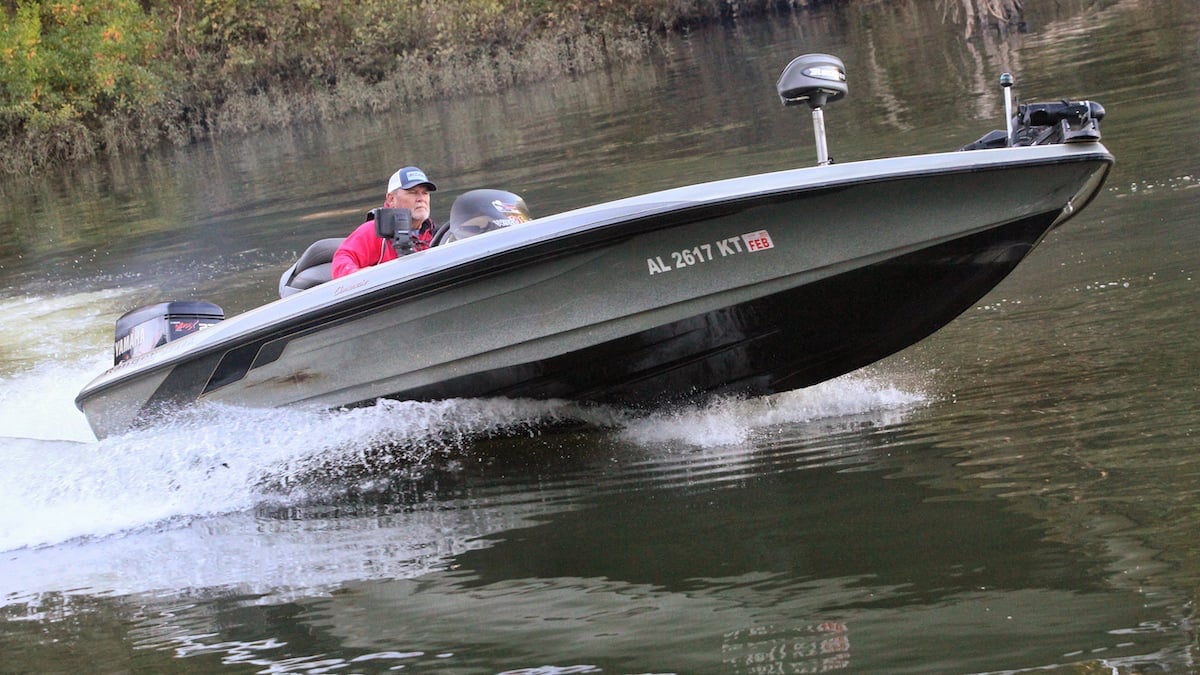 fisherman driving a bass boat