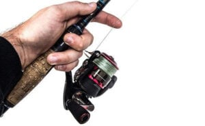 finger-on-spinning-reel-line-to-increase-bass-fishing-sensitivity.jpg