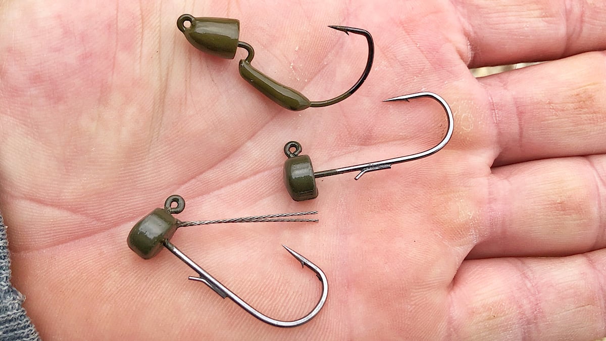 bass fishing jigheads in hand