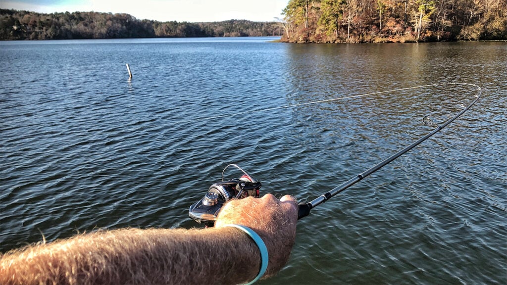 fisherman getting a lure unsnagged