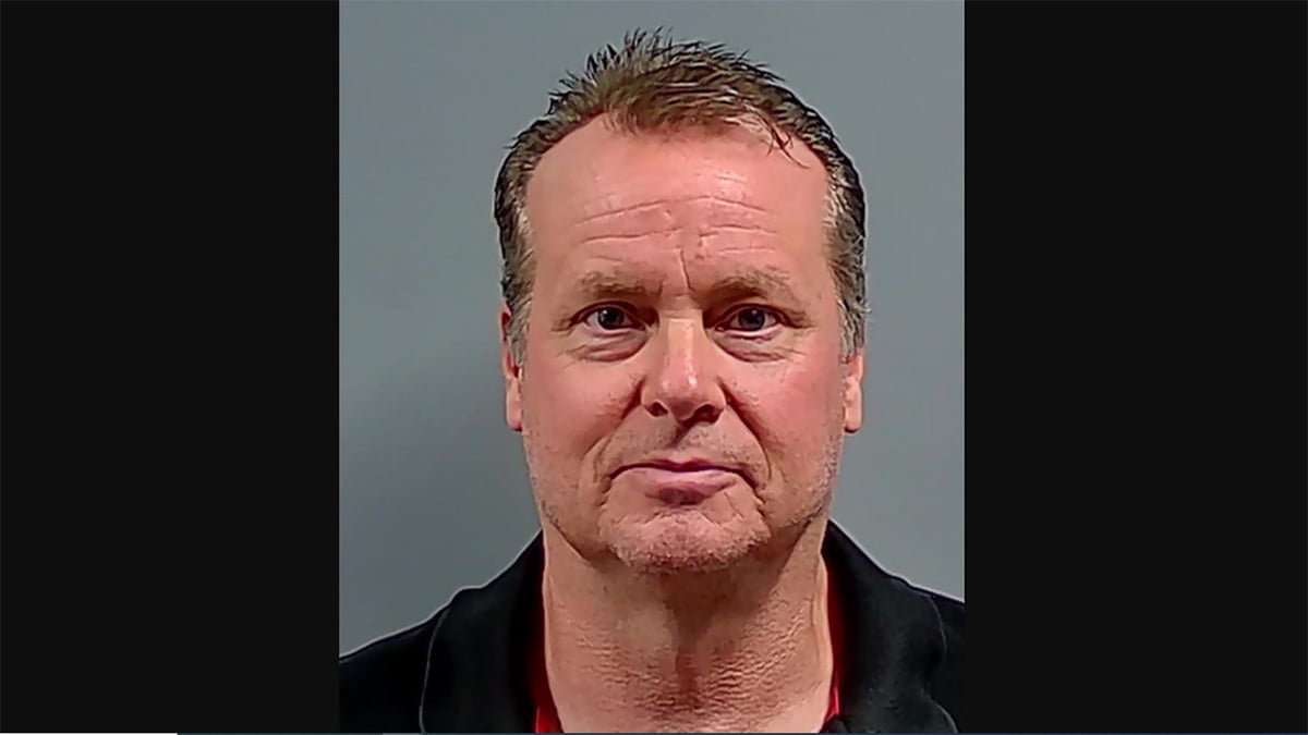 mugshot of man after alleged intentional boat crash