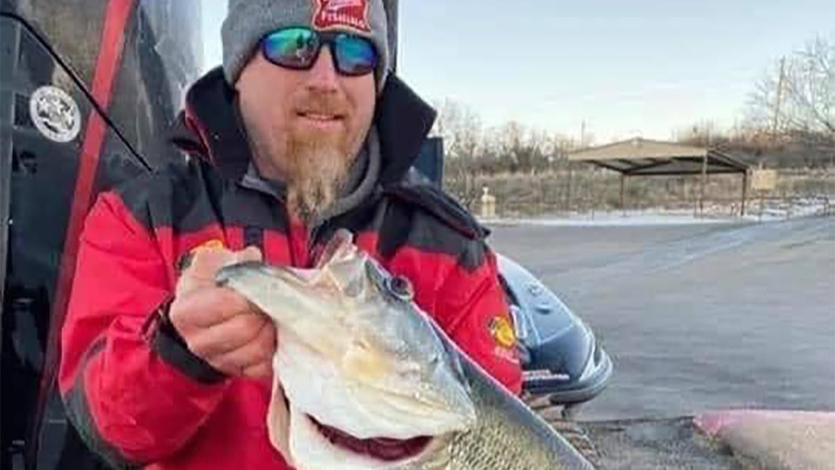 man holding 16-pound texas bass