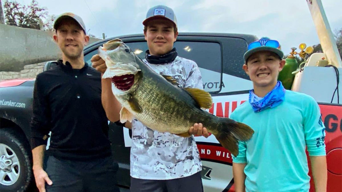 young man holding big bass in texas