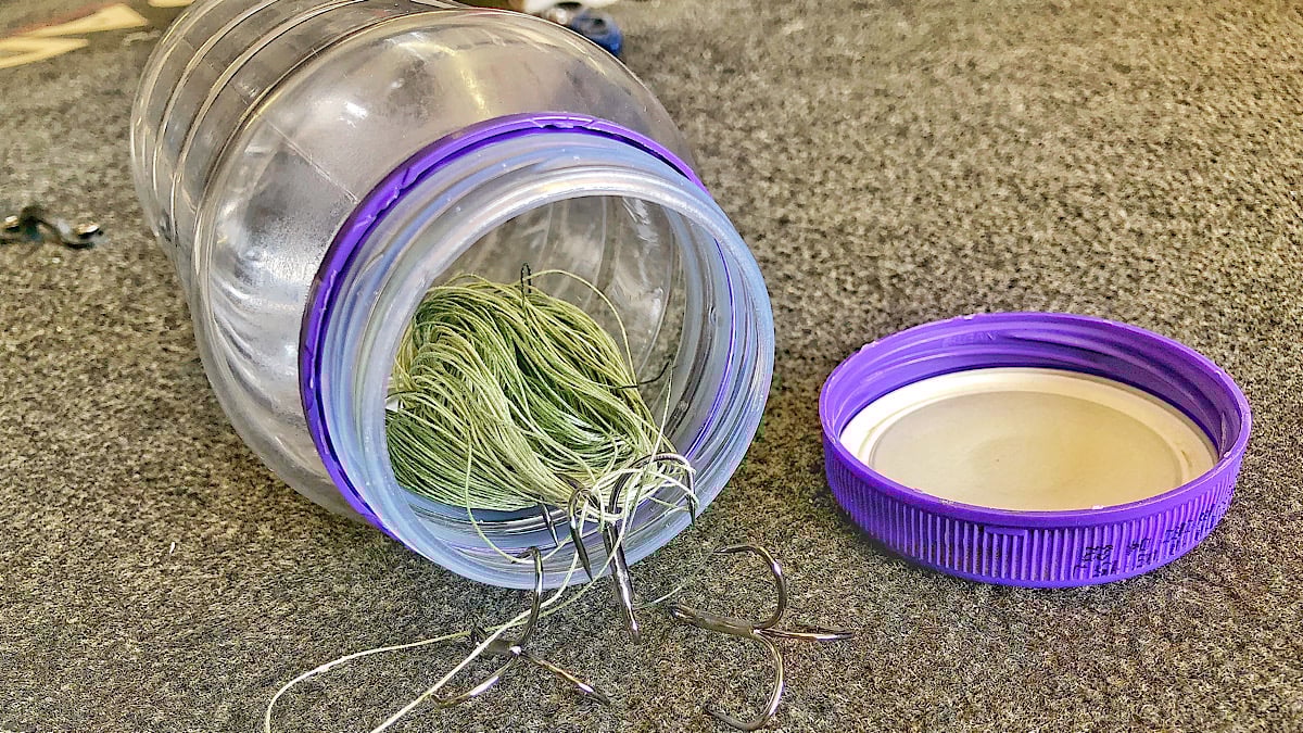 jar with fishing trash inside