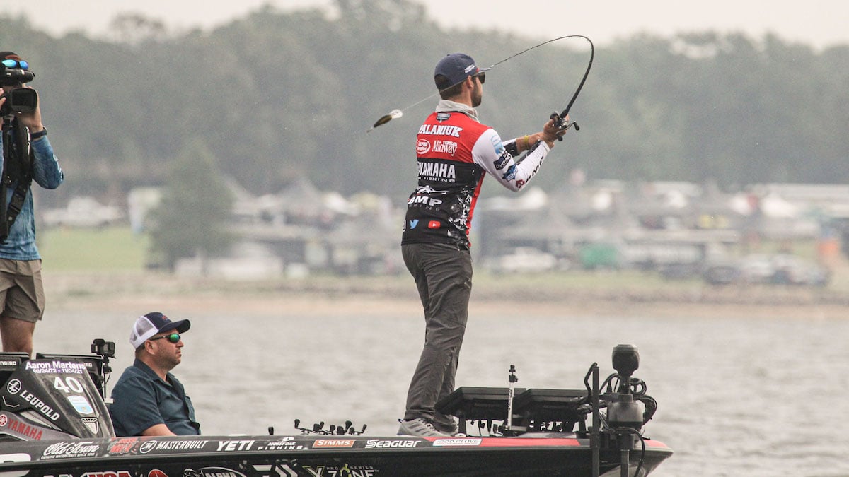 bass fisherman casting crankbait