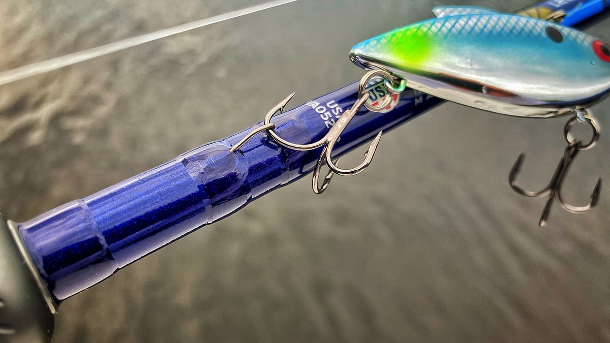 bass fishing lure hooked on bass fishing rod
