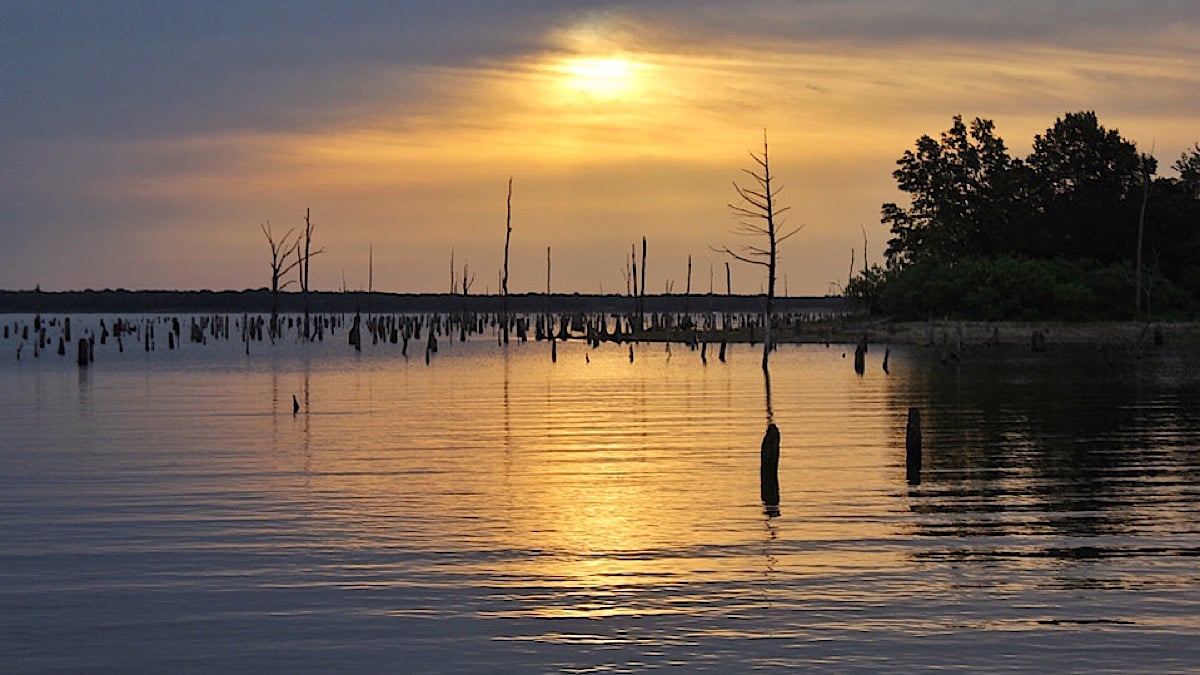 sunset over bass fishing lake