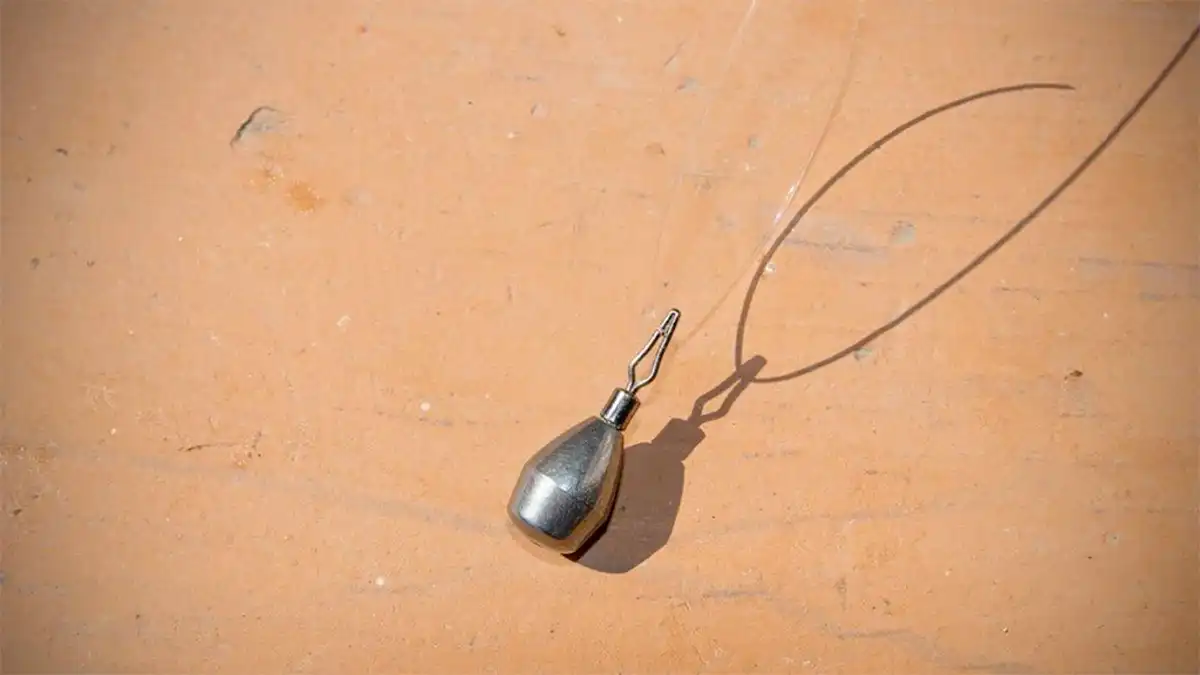 Specific drop shot weight with a clip tied to the leader