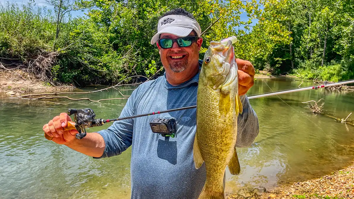 Jason smallmouth bass from small stream on BFS gear with a popper