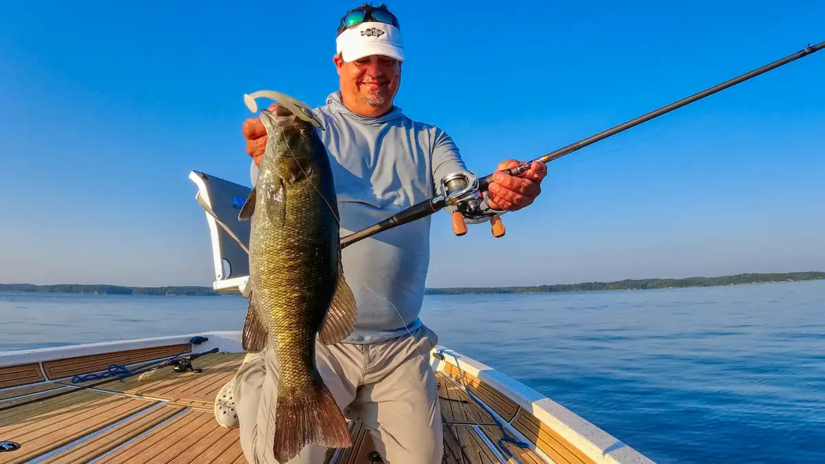 Jason big smallmouth on bates hundo and swimbait