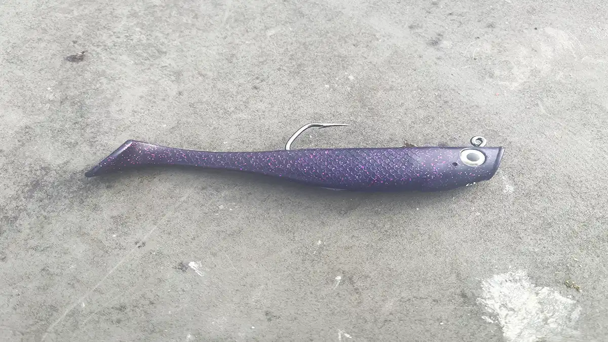 A single Hogy Pro Tail Paddle lure on a hard surface