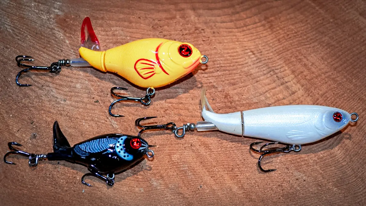 an assortment of three Whopper Plopper lures