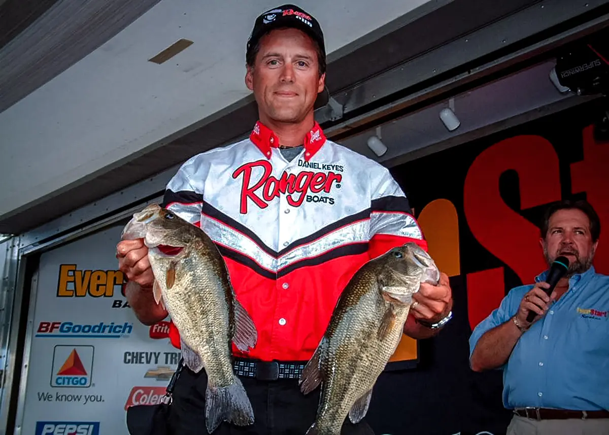 daniel keyes holding two bass