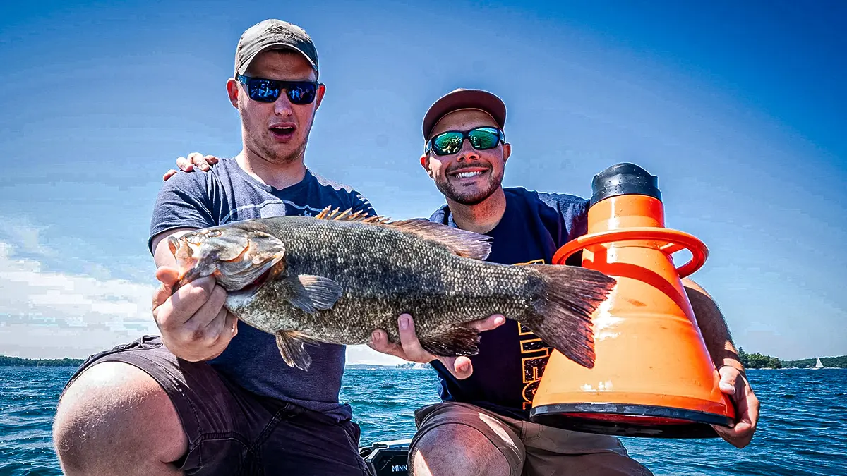two anglers with a bass and a flogger