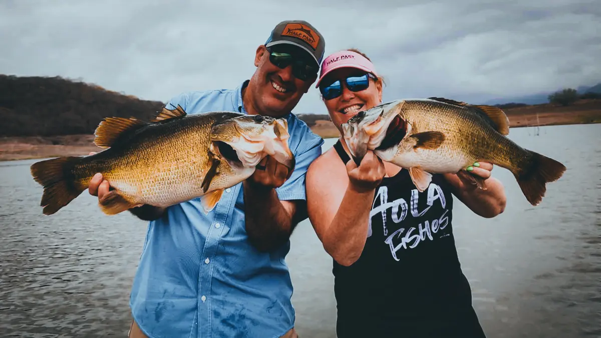 a couple with a pair of nice bass on el salto