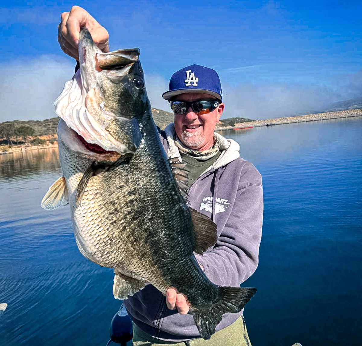 Jed Dickerson holds up his giant california bass