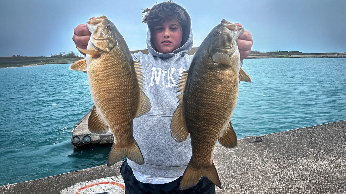 Noah with two Burnham Harbor smallmouths.