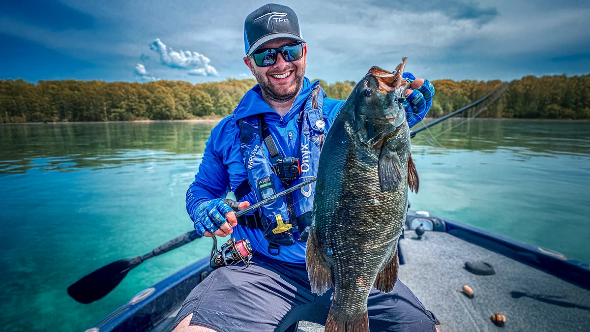 Ben Nowak holding a bass