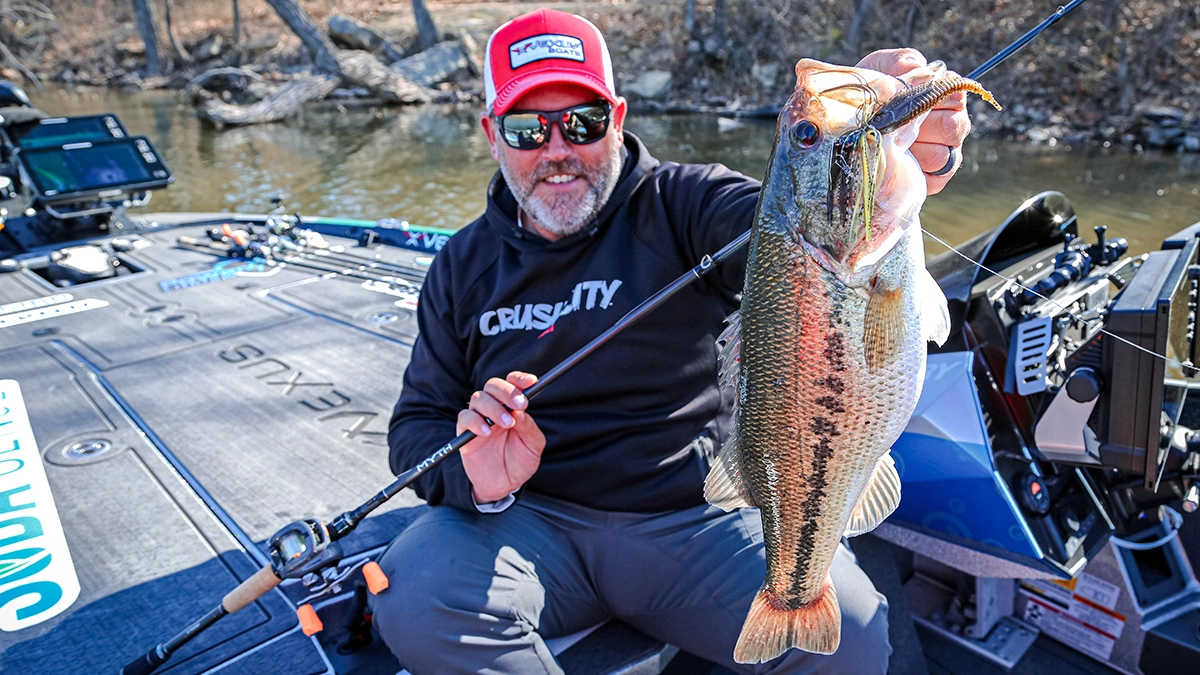 Adam Rasmussen holding a nice bass