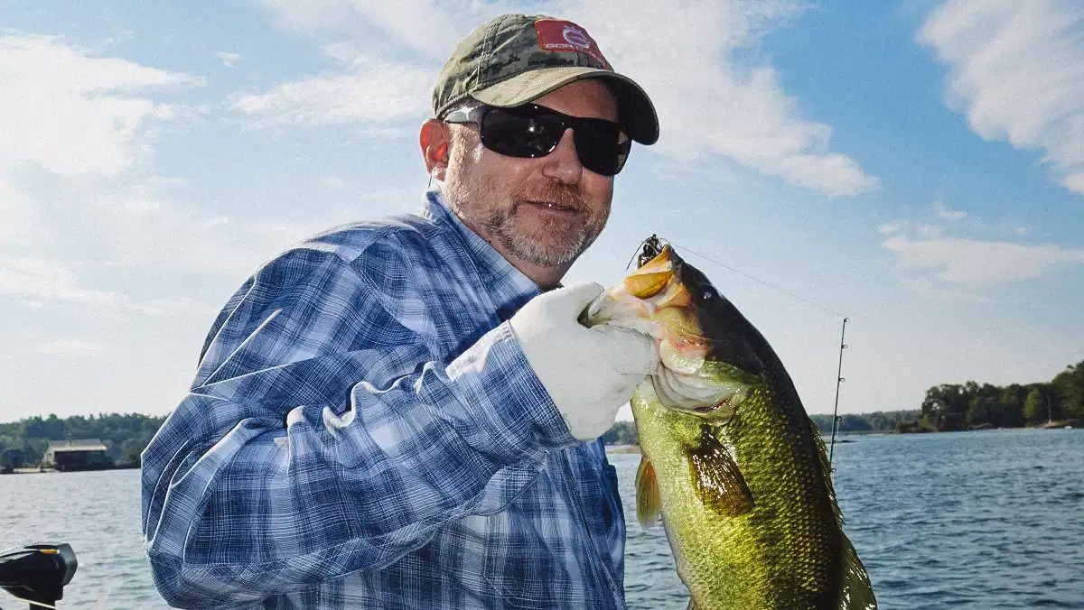 the author holding a bass