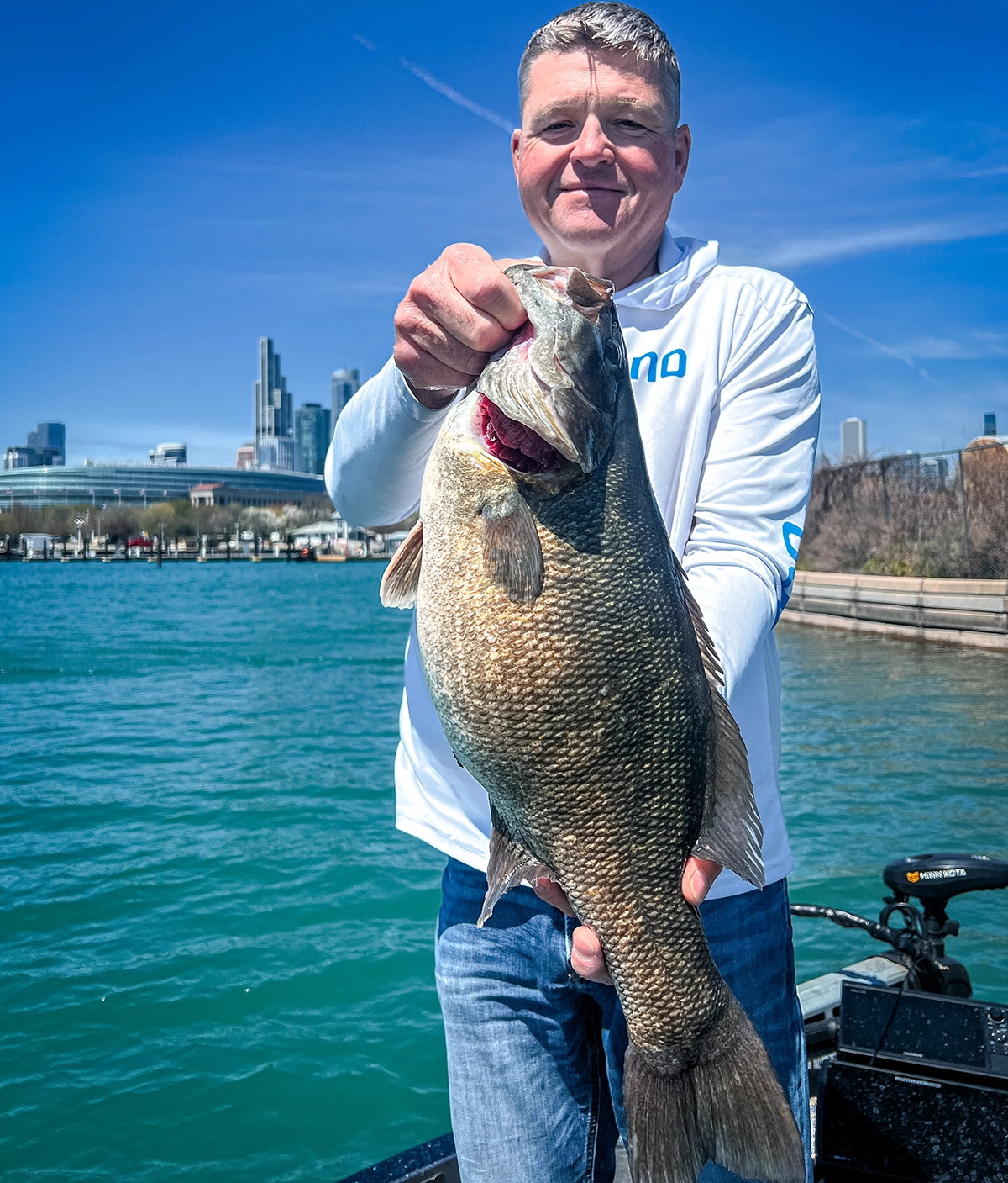 Kyle Danhausen with his 7-pound, 2-ounce smallmouth bass he caught on Lake Michigan in Chicago, Illinois.