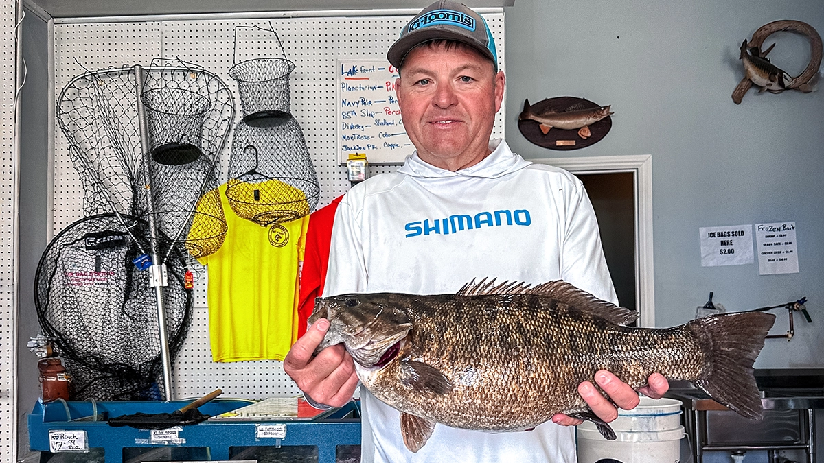 Kyle Danhausen with his 7-pound, 2-ounce smallmouth bass he caught on Lake Michigan in Chicago, Illinois.