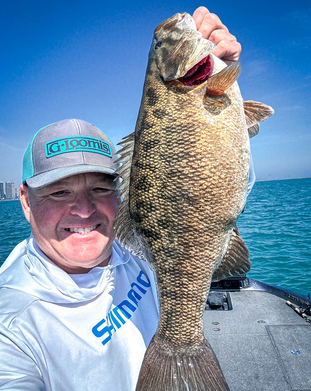 Kyle Danhausen with his 7-pound, 2-ounce smallmouth bass he caught on Lake Michigan in Chicago, Illinois.