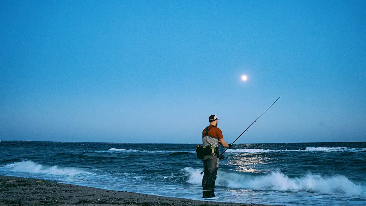 a man surf fishing