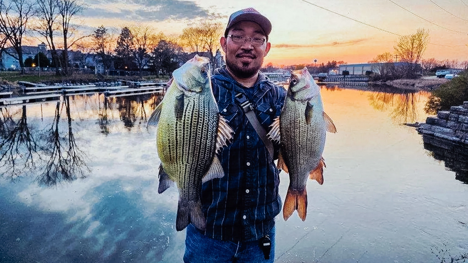 Vairin Meesouk with his pending wisconsin record yellow bass and a white bass