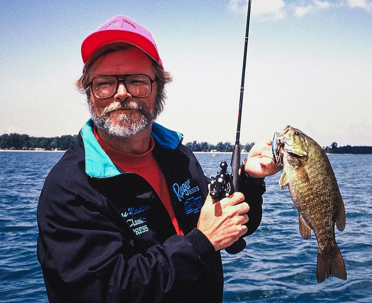 angler with rod and fish