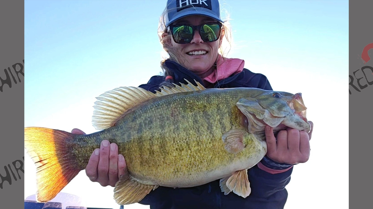 Brittney Wilton holds seven pound smallmouth