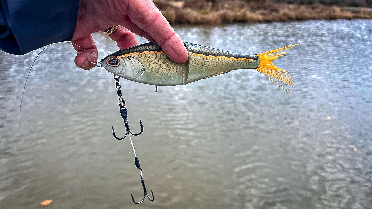Berkley PowerBait Chop Block with hook held over the water