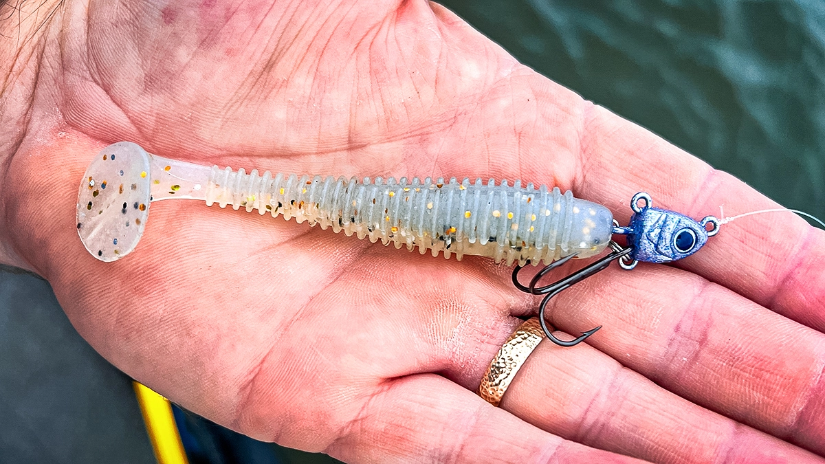 A closeup of a Buckeye Freestyle Swimbait jighead being shown in an open palm