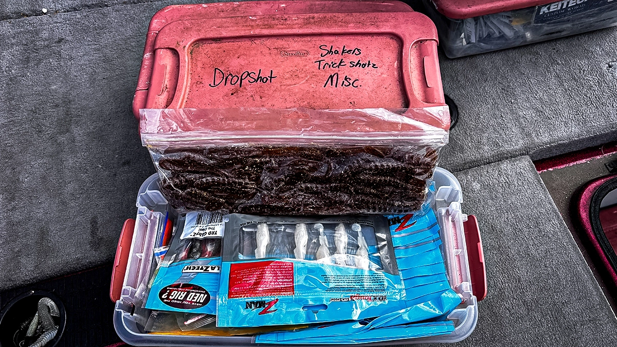 A red-lidded plastic boat bin labeled "Dropshot" and "Shakers, Trick Shotz, Misc."