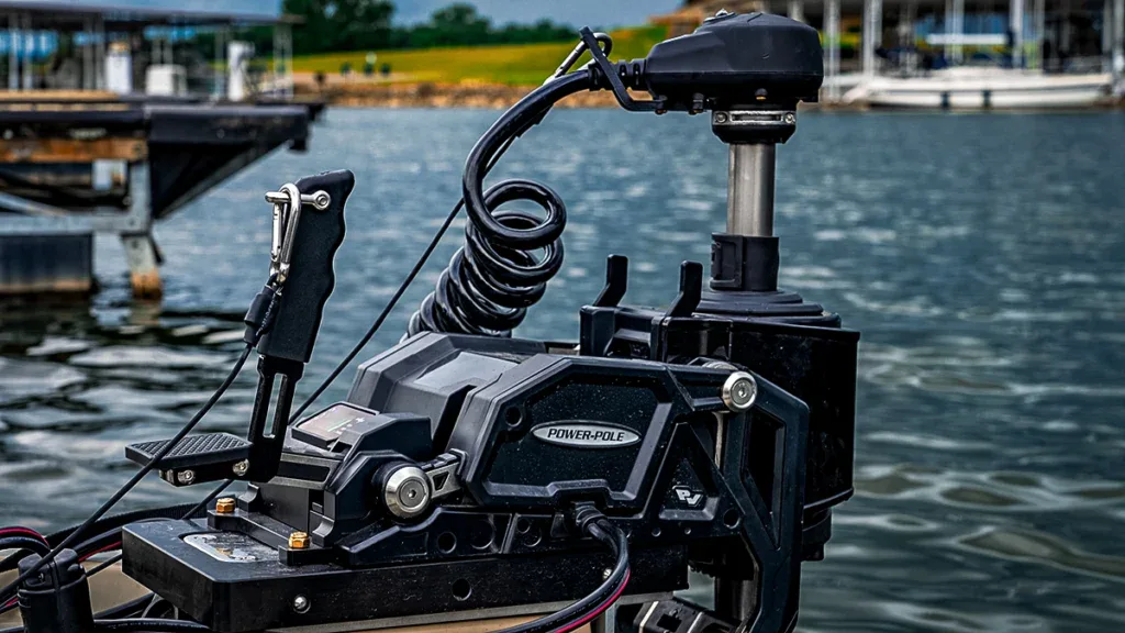 A Power Pole motor with the water and the shoreline in the distance