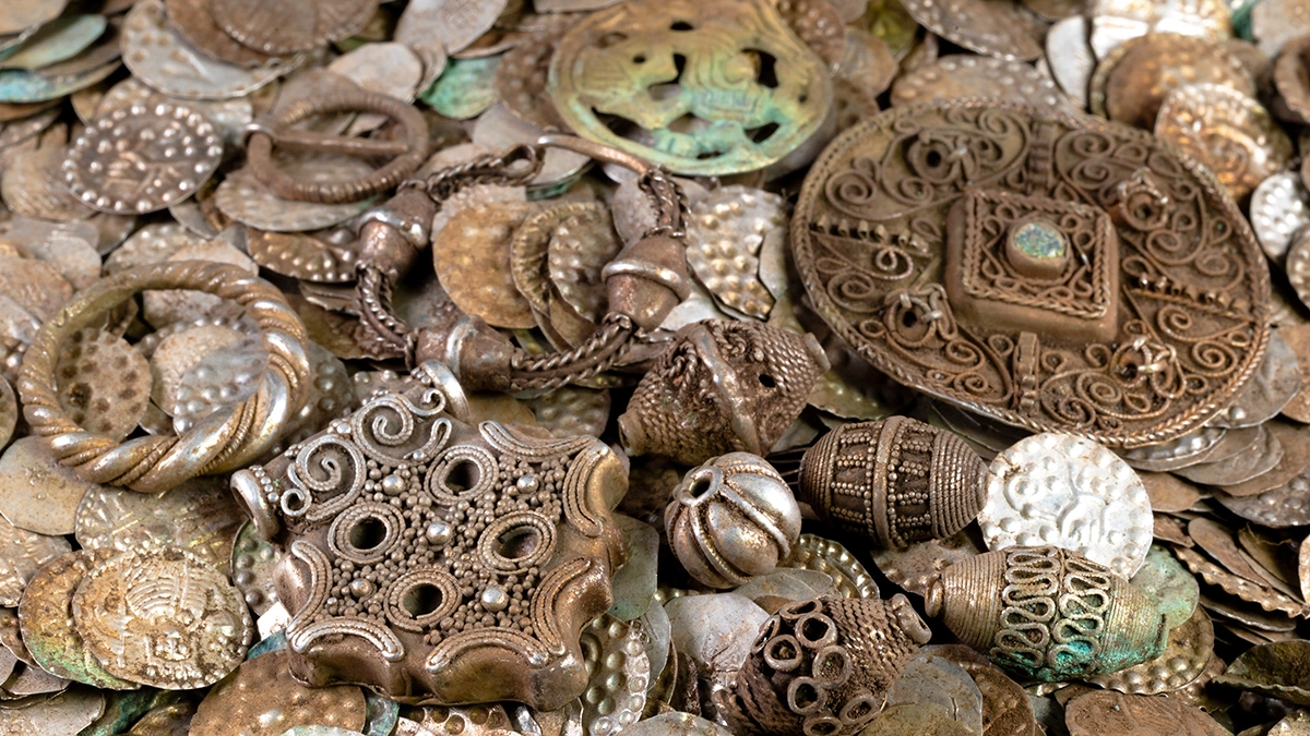 A close-up of some recently discovered century beads, coins and jewelry from the 12th-century