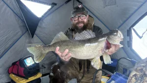 From Duck Calls to Jigging Raps: Angler Lures 12 Pound Walleye Through The Ice