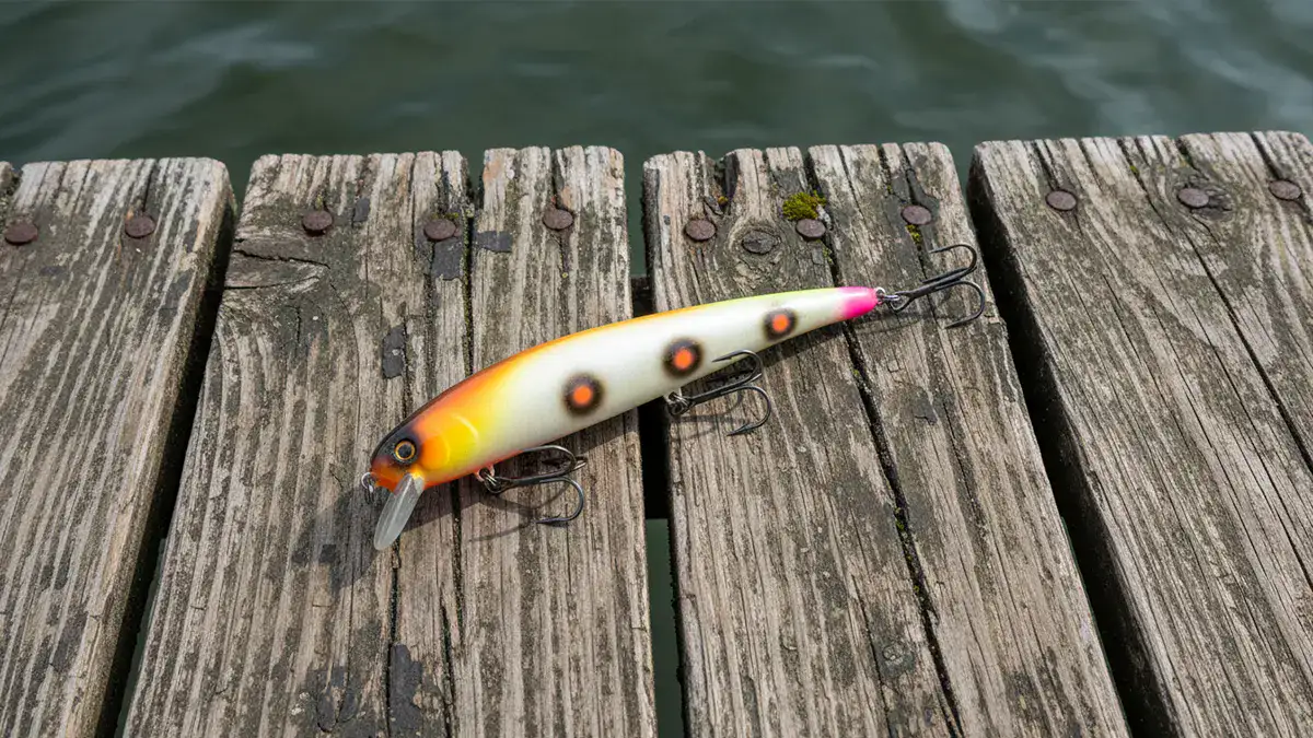 The Bomber Long A lure near the water's edge of a dock