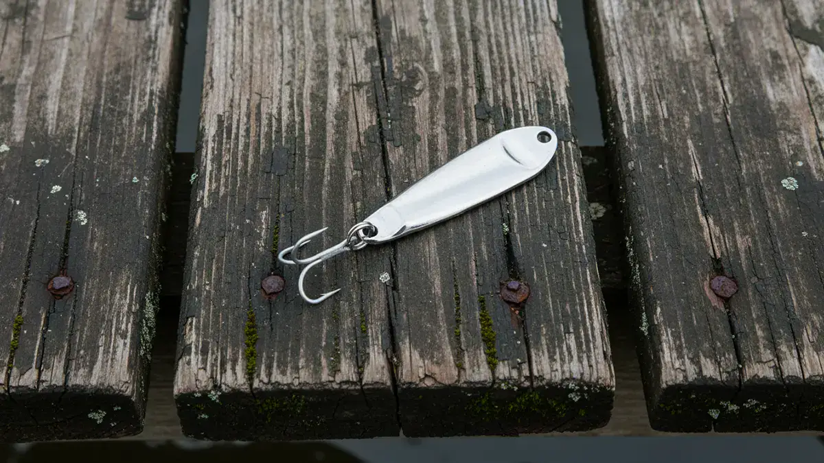 A silver Hopkins Smoothie lure on a dock