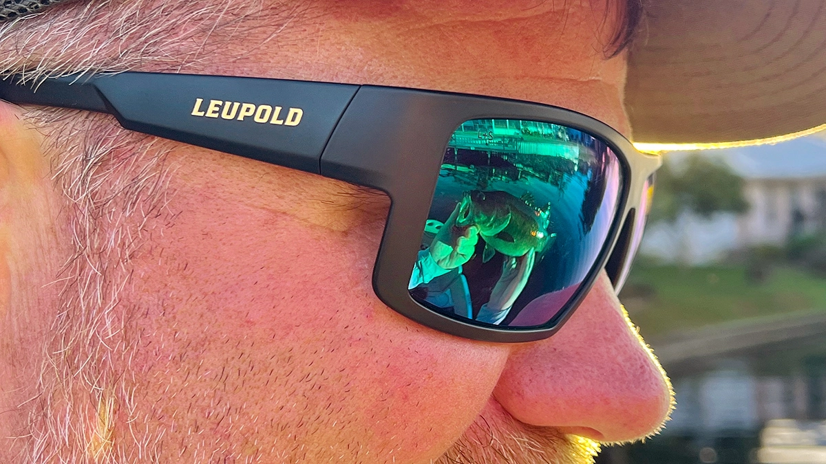 A closeup of a man wearing a pair of Leupold Performance Eyewear Switchback Sunglasses