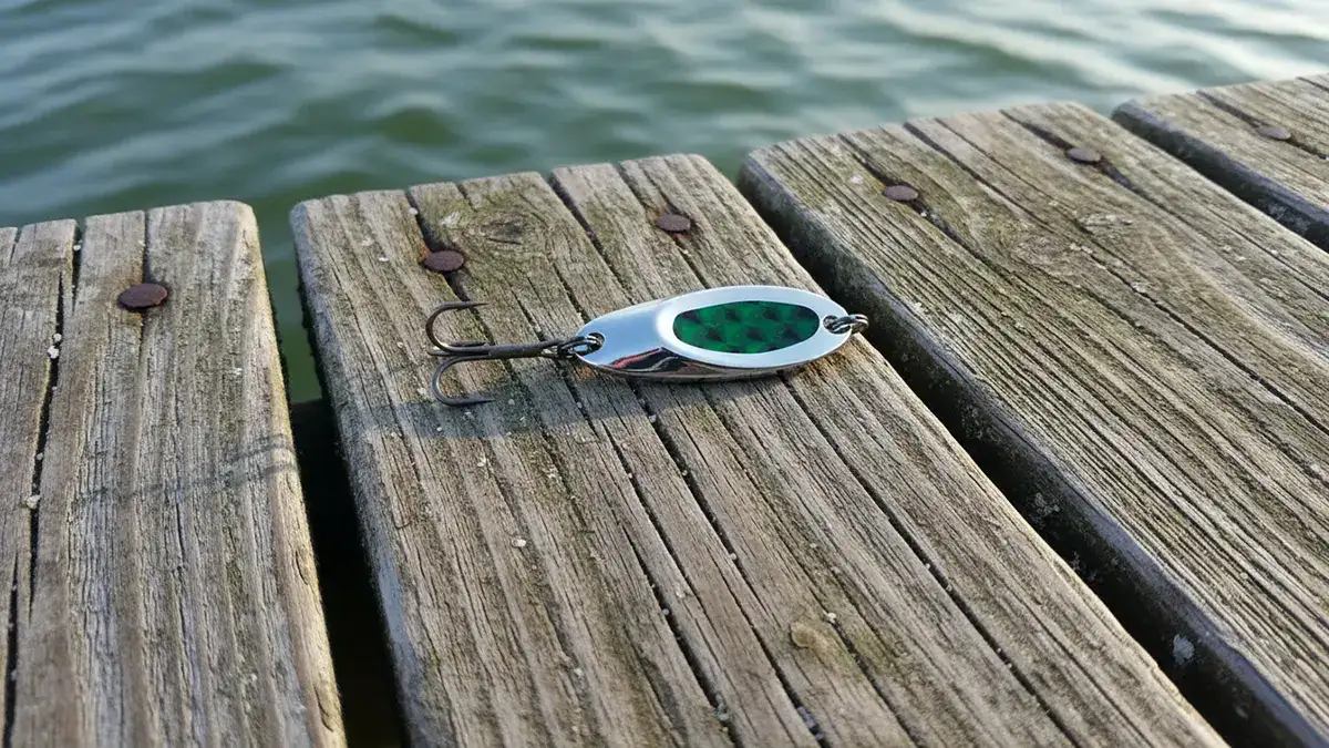 A silver Luhr‑Jensen Cast Champ lure