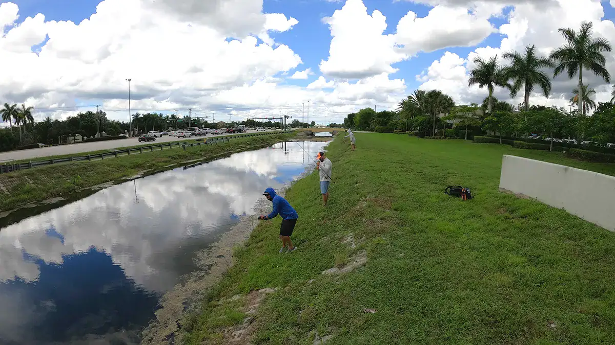 Anglers fish a South Florida canal.