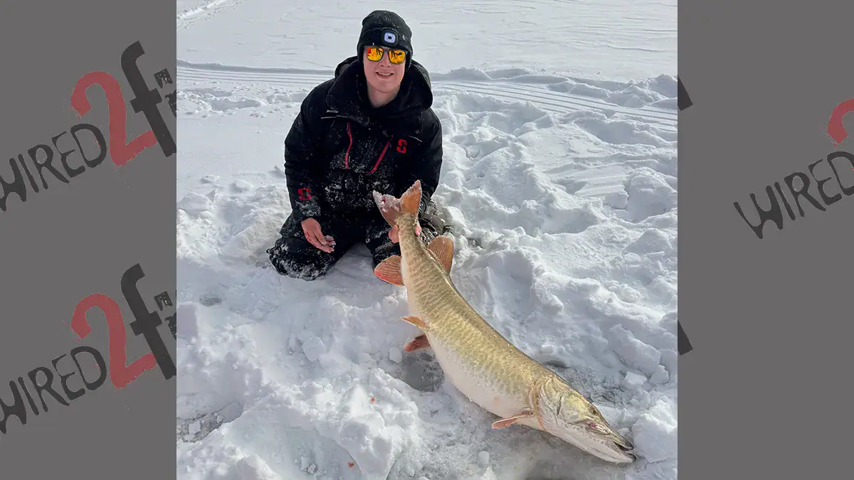 Brett Baldwin and the 52-Inch muskie he pulled through ice on the Allegheny Reservoir.