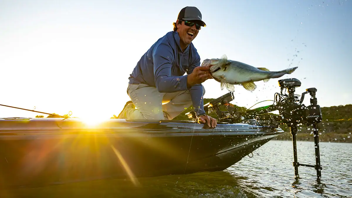 An angler using Garmin's new GT360UHD 360-degree scanning transducer and Spy Pole motorized sonar control catches a fish.