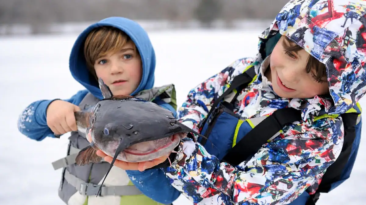 Brothers Jacob and Parker Trantalis with the mystery fish Jacob caught Feb. 22.