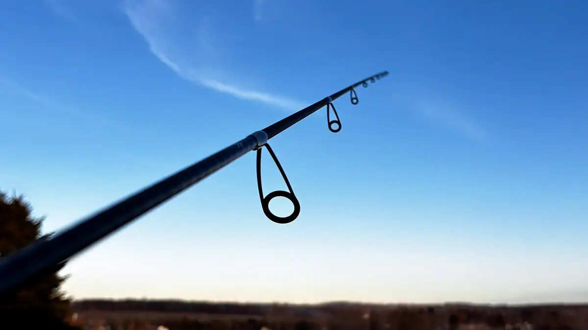 The tip of a Shimano Compre Lite Series rod pointed toward the sky.
