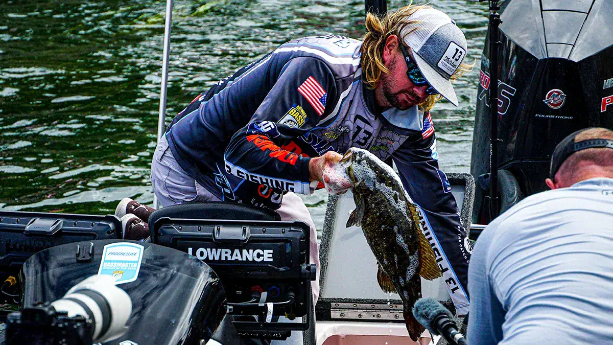 A tournament angler holds the fish he caught.