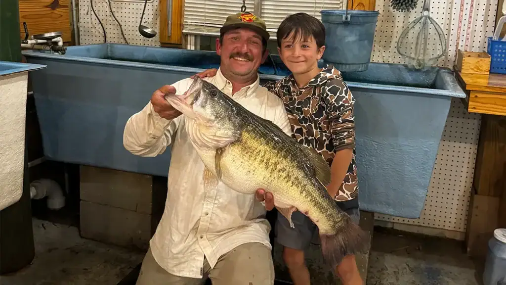 Greer Billeaud and son with big bass