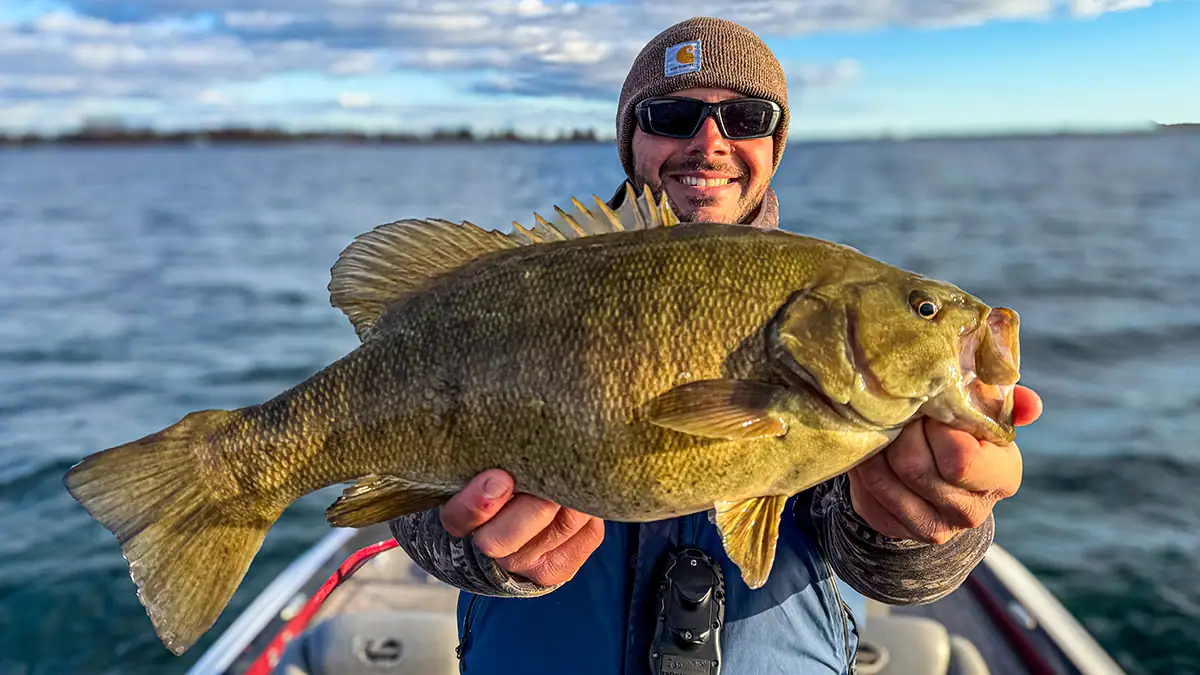 Showing off a bass caught with a skirted jig.